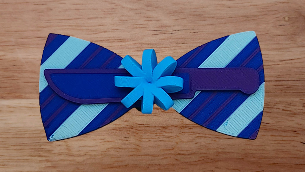 Gift Bow Base with Machete/Knife Brim and Wrapping Paper Back