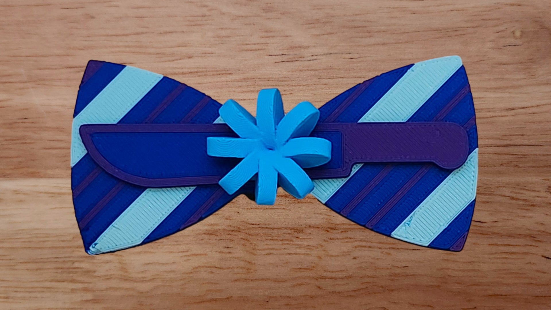 Gift Bow Base with Machete/Knife Brim and Wrapping Paper Back