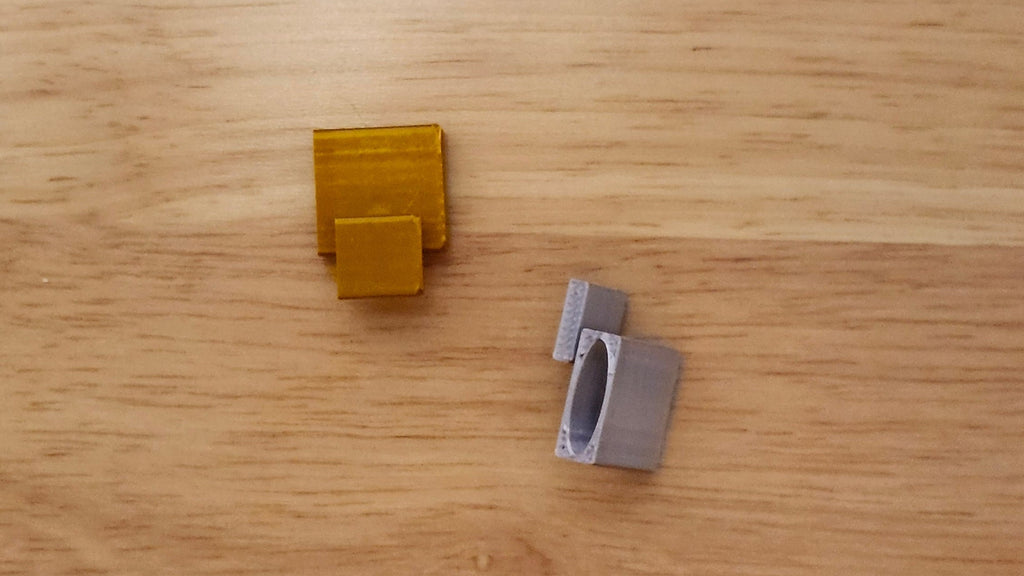 Two Necklace Adapters, one on it's side the other from the front