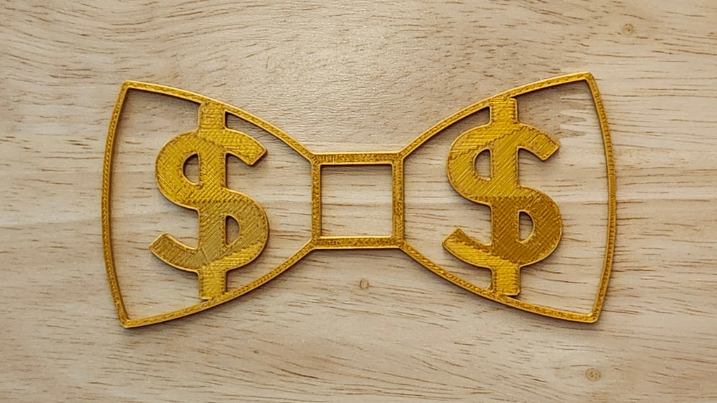 Gold Money Bow for use with a Blend and Build Blueprint Button Cover. Together they are 3D printed for use as a bow tie, button cover, necklace, pin, hat pin, lapel pin and so much more. 
