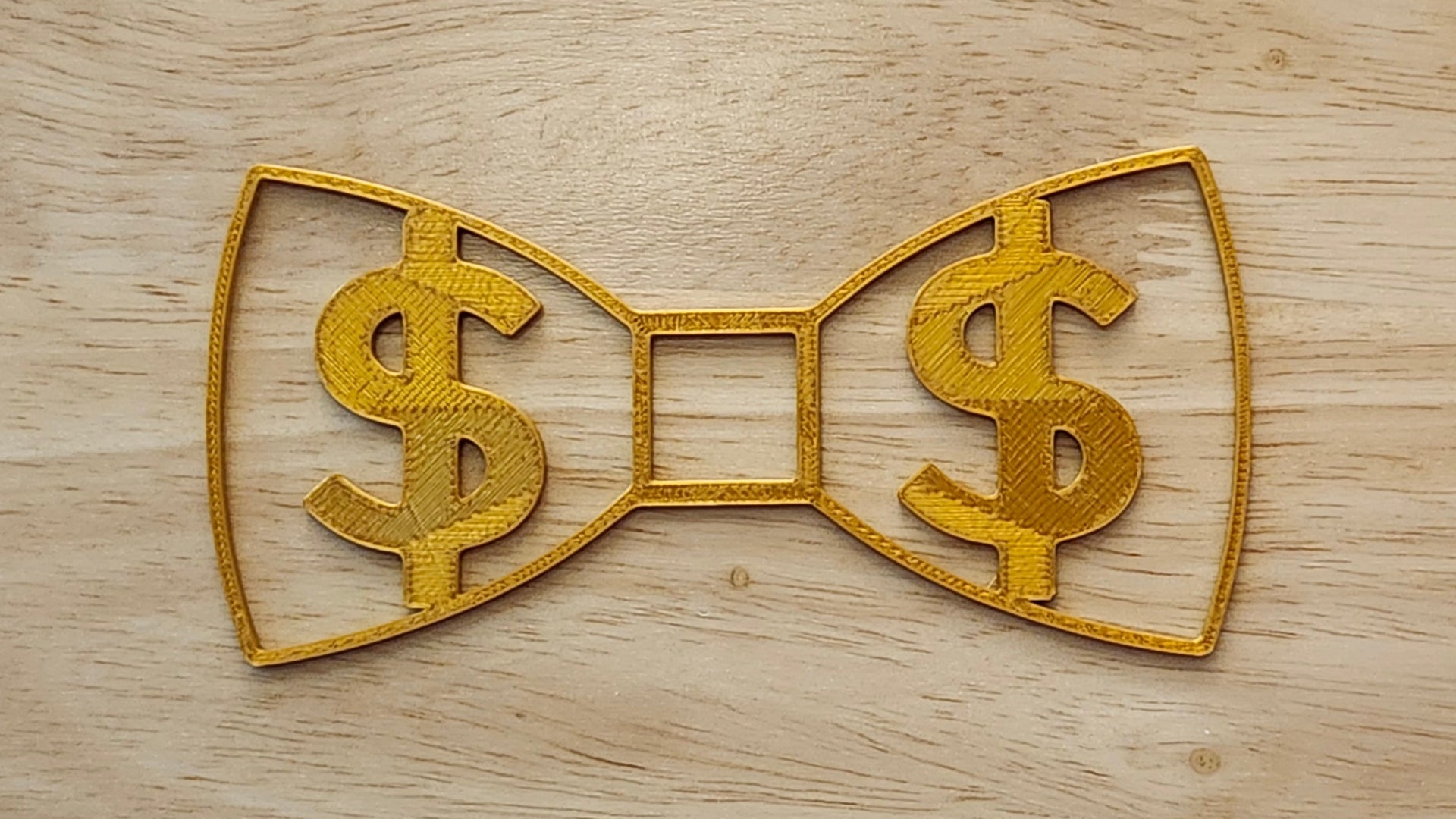 Gold Money Bow for use with a Blend and Build Blueprint Button Cover. Together they are 3D printed for use as a bow tie, button cover, necklace, pin, hat pin, lapel pin and so much more. 