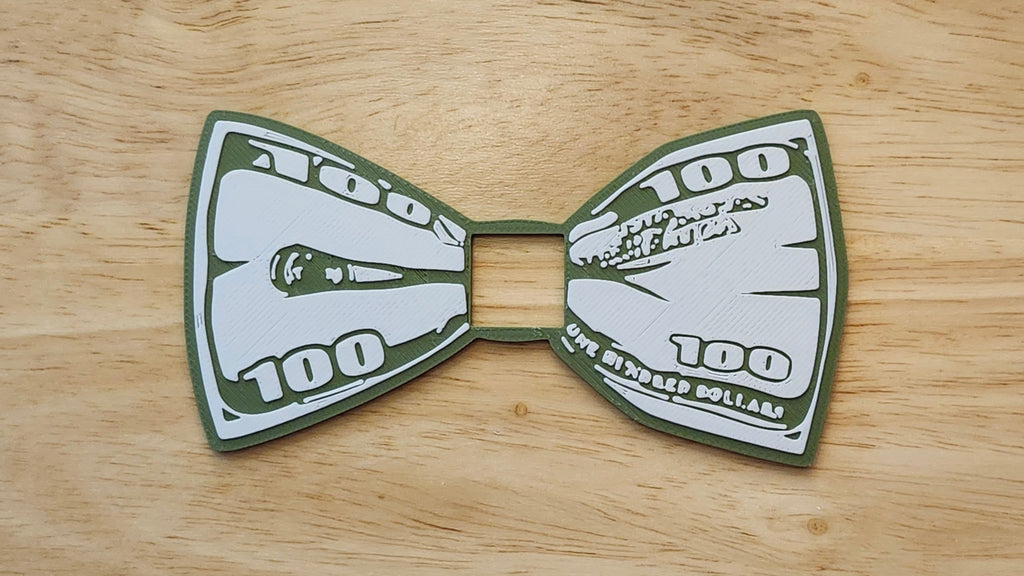 100 Dollar Bill Bow for use with a Blend and Build Blueprint Button Cover. Together they are 3D printed for use as a bow tie, button cover, necklace, pin, hat pin, lapel pin and so much more. 