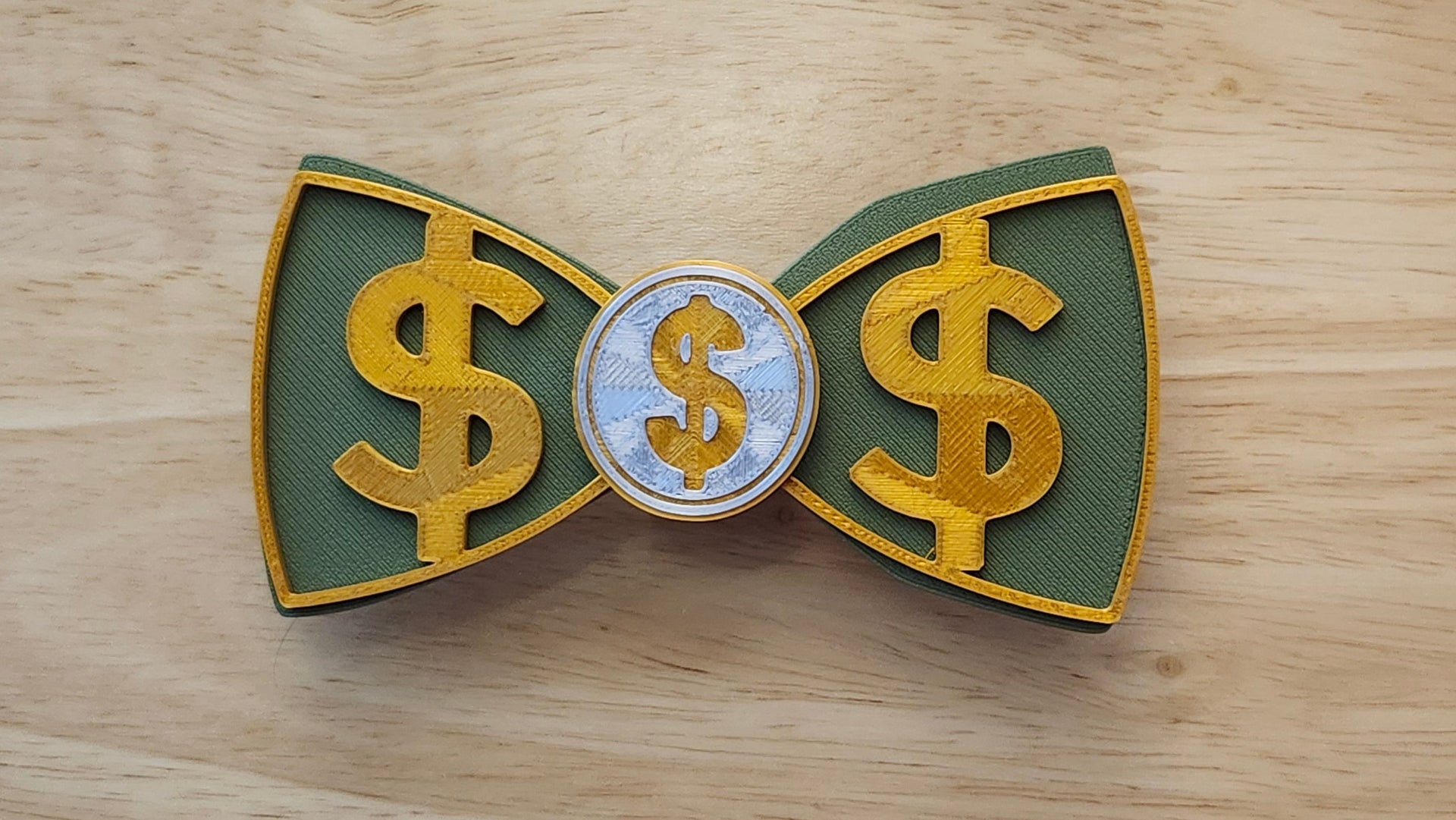 Money Bow Bundle including Coin Button Cover, 100 Dollar Bill Bow (reverse side shown) with Gold Money Bow. 3D printed for use as a bow tie, button cover, necklace, pin, hat pin, lapel pin and so much more. 