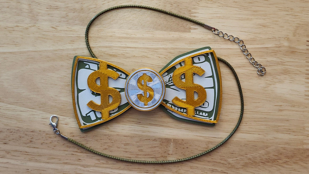 Money Bow Bundle including Coin Button Cover, 100 Dollar Bill Bow, Gold Money Bow, a safety pin and money green necklace. 3D printed for use as a bow tie, button cover, necklace, pin, hat pin, lapel pin and so much more. 