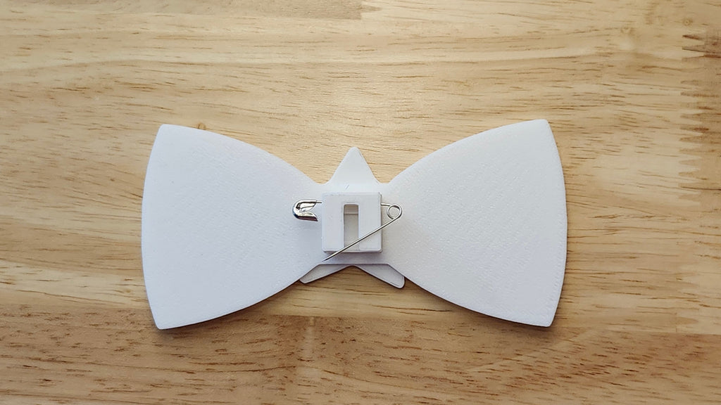 Bespoke It Yourself/Solid White Bow Bundle including Star Button Cover and Blank Bow reverse side shown to demonstrate how to turn it in to a pin with the included safety pin.  3D printed for use as a bow tie, button cover, necklace, pin, hat pin, lapel pin and so much more.