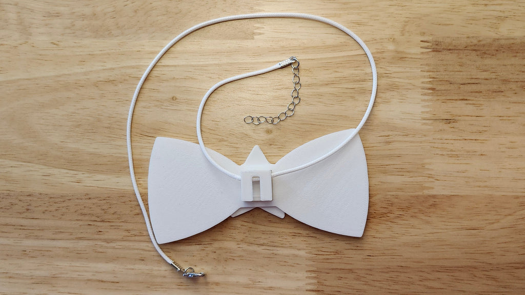Bespoke It Yourself/Solid White Bow Bundle including Star Button Cover and Blank Bow, reverse side shown to demonstrate how it is worn with the included necklace. 3D printed for use as a bow tie, button cover, necklace, pin, hat pin, lapel pin and so much more.