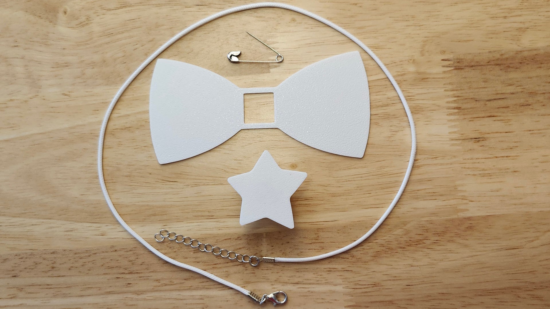 Bespoke It Yourself/Solid White Bow Bundle including Star Button Cover and Blank Bow, a safety pin and white necklace. 3D printed for use as a bow tie, button cover, necklace, pin, hat pin, lapel pin and so much more. 