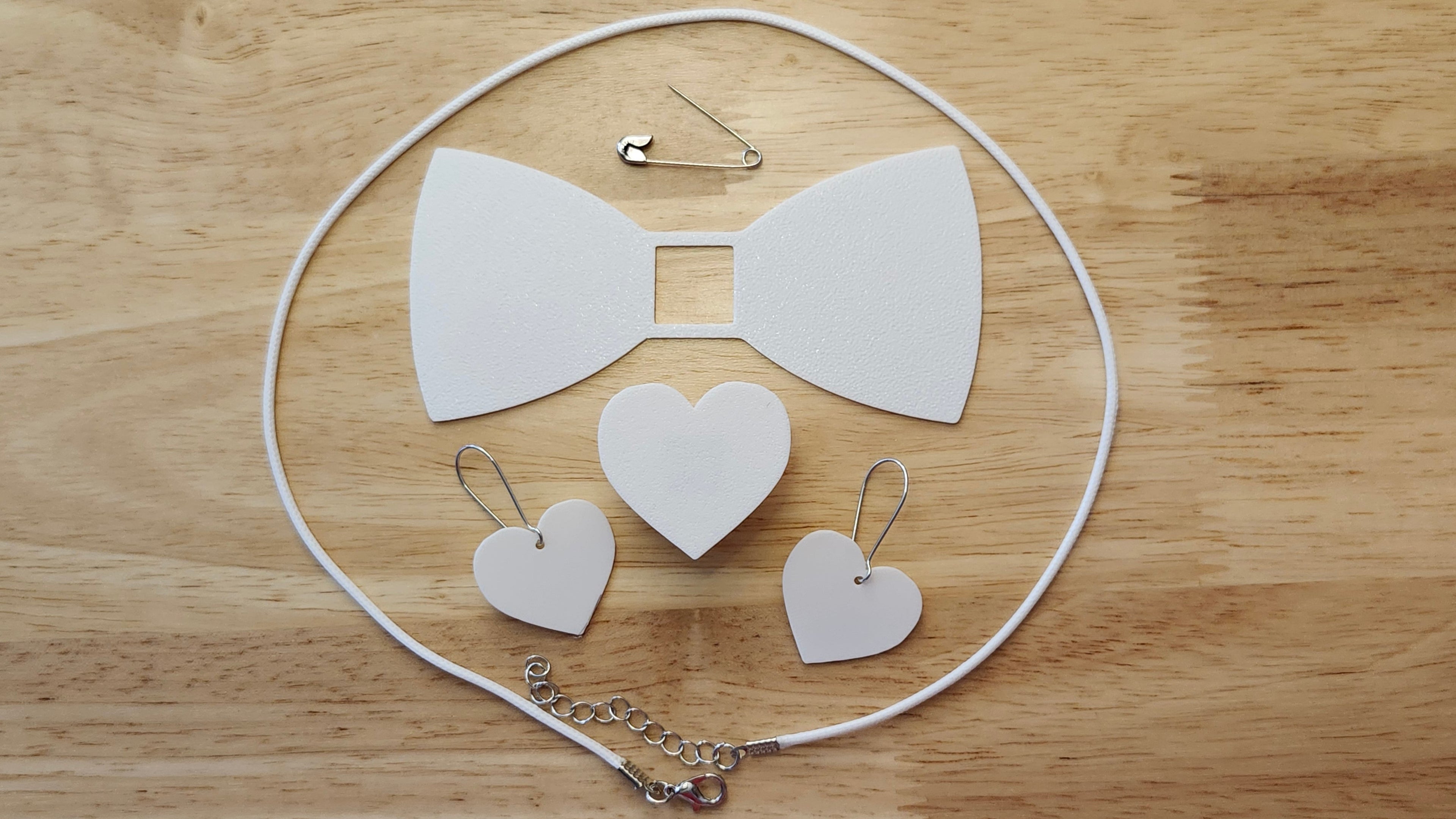 Bespoke It Yourself/Solid White Bow Bundle including Heart Button Cover and Blank Bow, matching Heart earrings, a safety pin and white necklace. 3D printed for use as a bow tie, button cover, necklace, pin, hat pin, lapel pin and so much more. 
