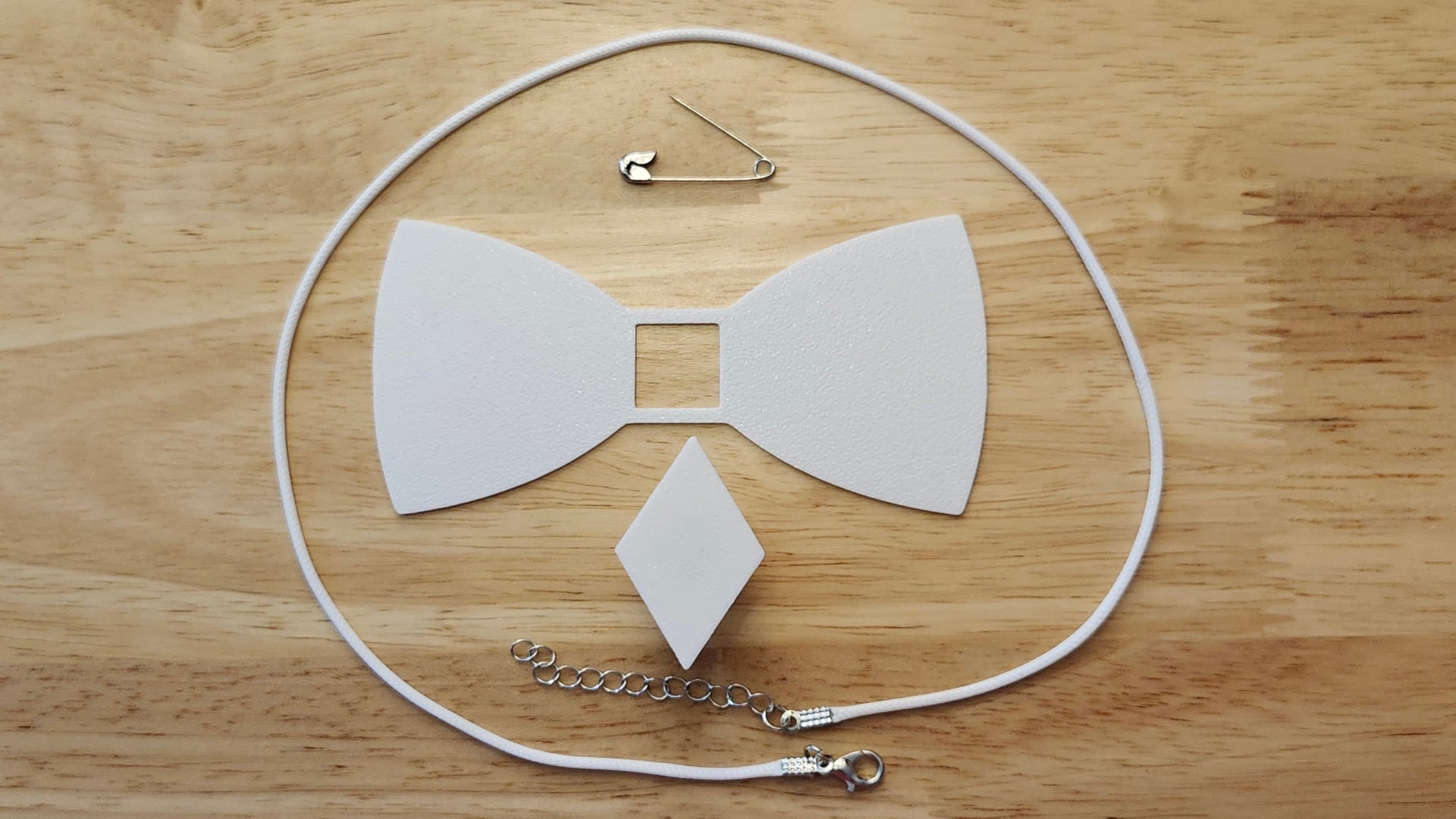 Bespoke It Yourself/Solid White Bow Bundle including Diamond Button Cover and Blank Bow, a safety pin and white necklace. 3D printed for use as a bow tie, button cover, necklace, pin, hat pin, lapel pin and so much more. 
