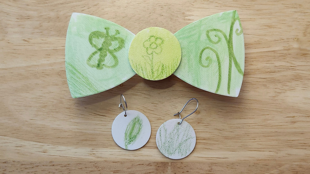 Bespoke It Yourself/Solid White Bow Bundle decorated sample including Circle Button Cover and Blank Bow with matching Circle earrings. 3D printed then hand colored by the customer for use as a bow tie, button cover, necklace, pin, hat pin, lapel pin and so much more.