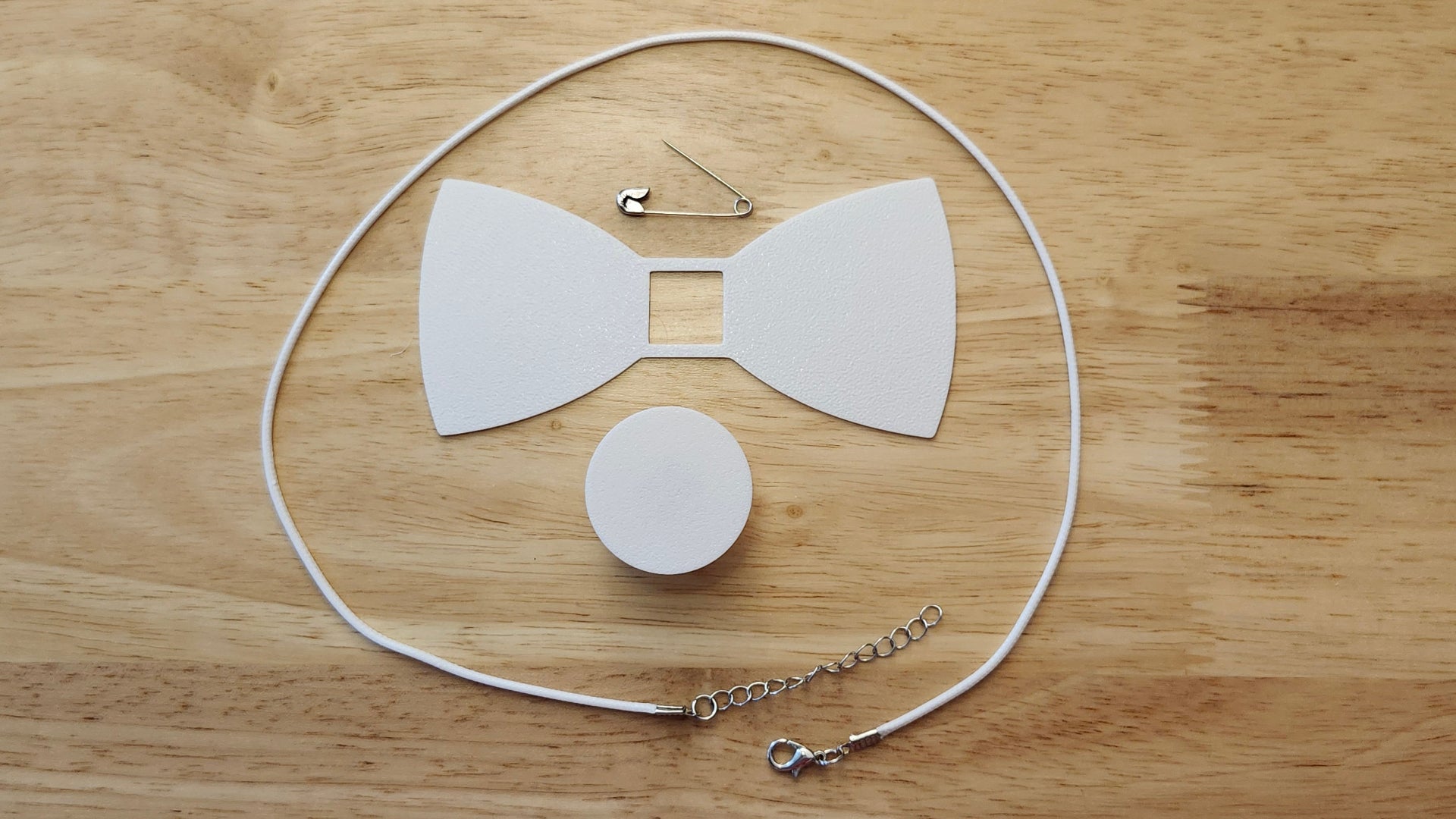 Bespoke It Yourself/Solid White Bow Bundle including Circle Button Cover and Blank Bow, a safety pin and white necklace. 3D printed for use as a bow tie, button cover, necklace, pin, hat pin, lapel pin and so much more. 
