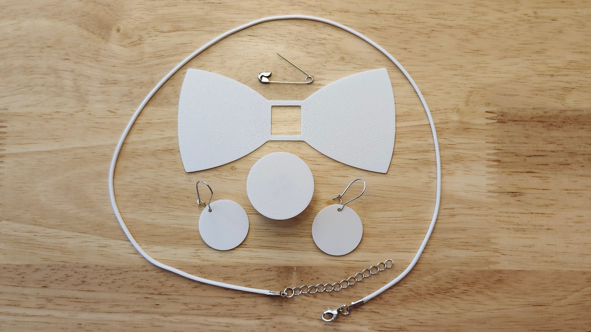 Bespoke It Yourself/Solid White Bow Bundle including Circle Button Cover and Blank Bow, matching Circle earrings, a safety pin and white necklace. 3D printed for use as a bow tie, button cover, necklace, pin, hat pin, lapel pin and so much more. 