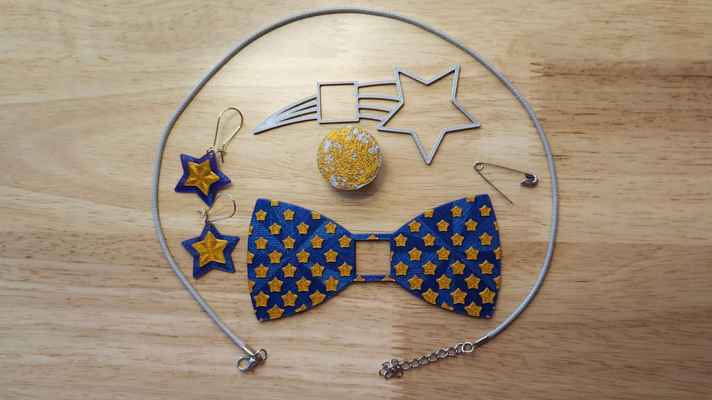 Starry Night Bow Bundle including Moon Button Cover, Diminishing  Stars Bow, Shooting Star Back, matching star earrings, a safety pin and silvery necklace. 3D printed for use as a bow tie, button cover, necklace, pin, hat pin, lapel pin and so much more. 