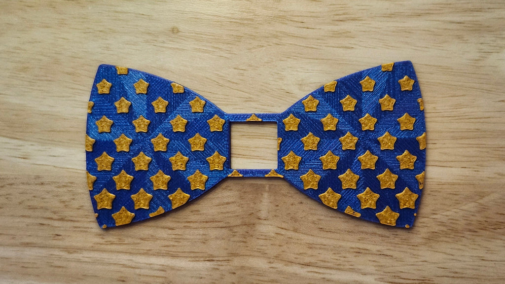 Diminishing Star Bow for use with a Blend and Build Blueprint Button Cover. Together they are 3D printed for use as a bow tie, button cover, necklace, pin, hat pin, lapel pin and so much more.