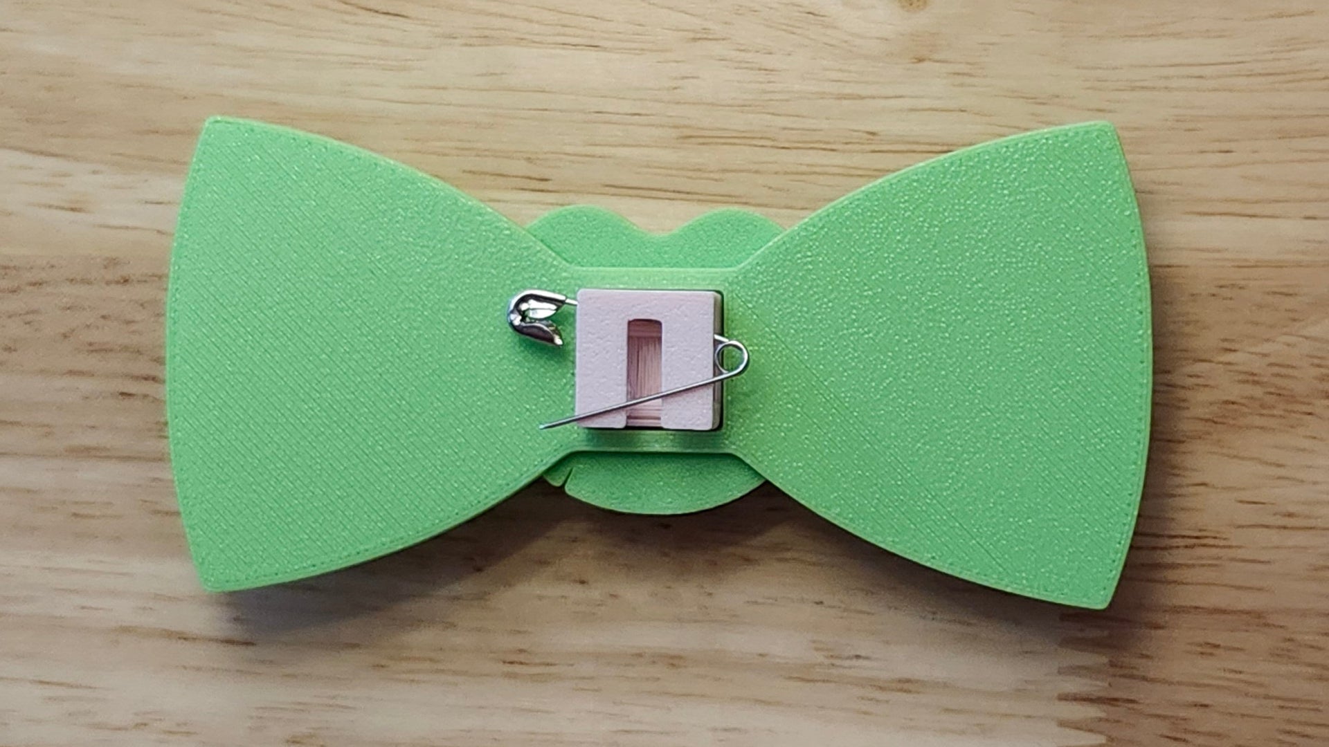 Lotus Flower Button Cover, Lotus Bow, and Lily Pad Back reverse side shown to demonstrate how to turn it in to a pin with the included safety pin. 