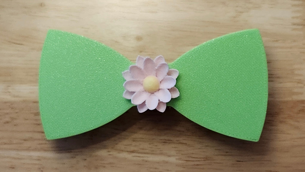 Lotus Flower Button Cover with Lotus Bow (reverse side). 3D printed for use as a bow tie, button cover, necklace, pin, hat pin, lapel pin and so much more. 
