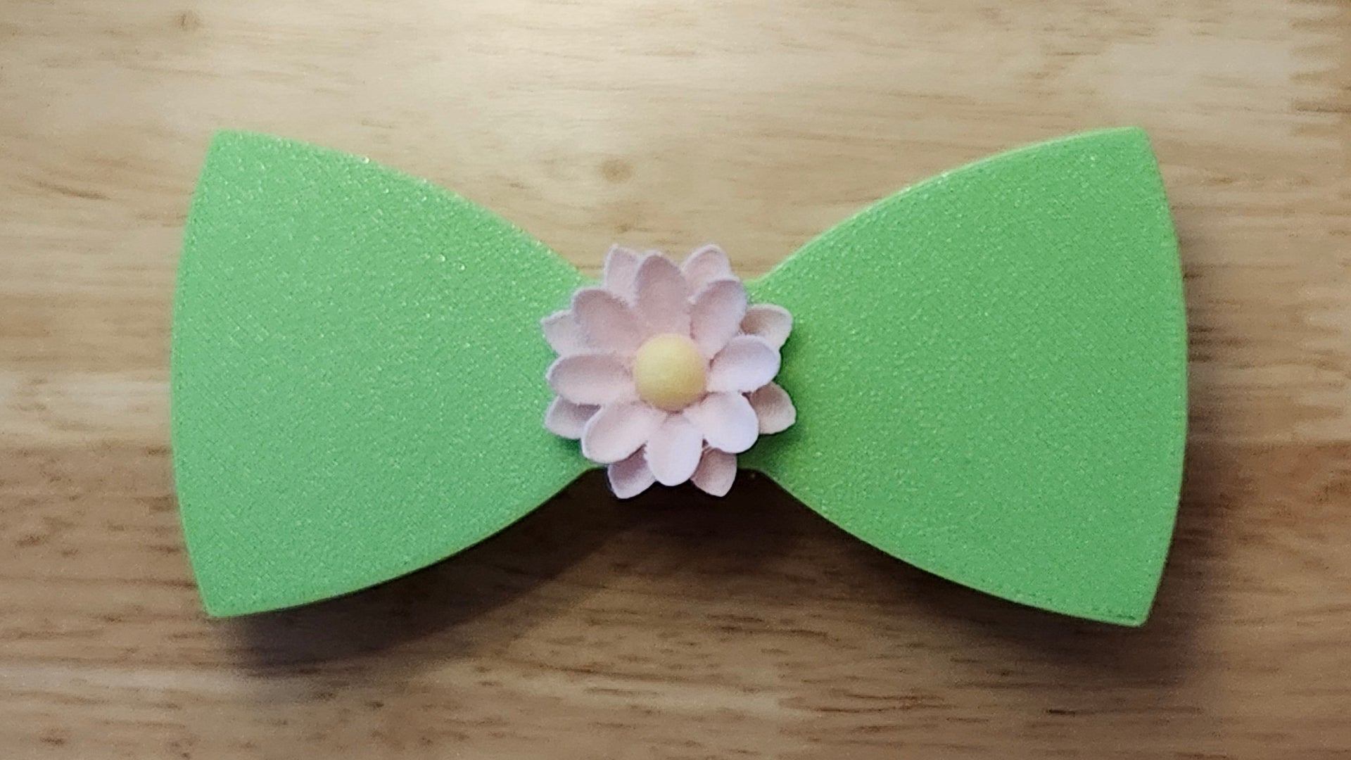 Lotus Flower Button Cover with Lotus Bow (reverse side). 3D printed for use as a bow tie, button cover, necklace, pin, hat pin, lapel pin and so much more. 