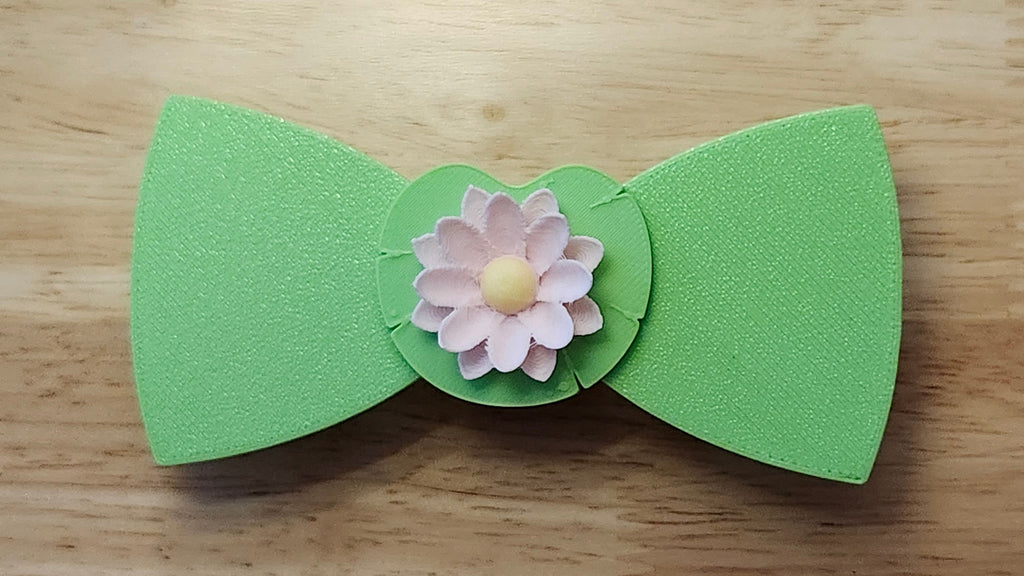 Lotus Flower Button Cover with Lotus Bow (reverse side), and Lily Pad Back. 3D printed for use as a bow tie, button cover, necklace, pin, hat pin, lapel pin and so much more. 