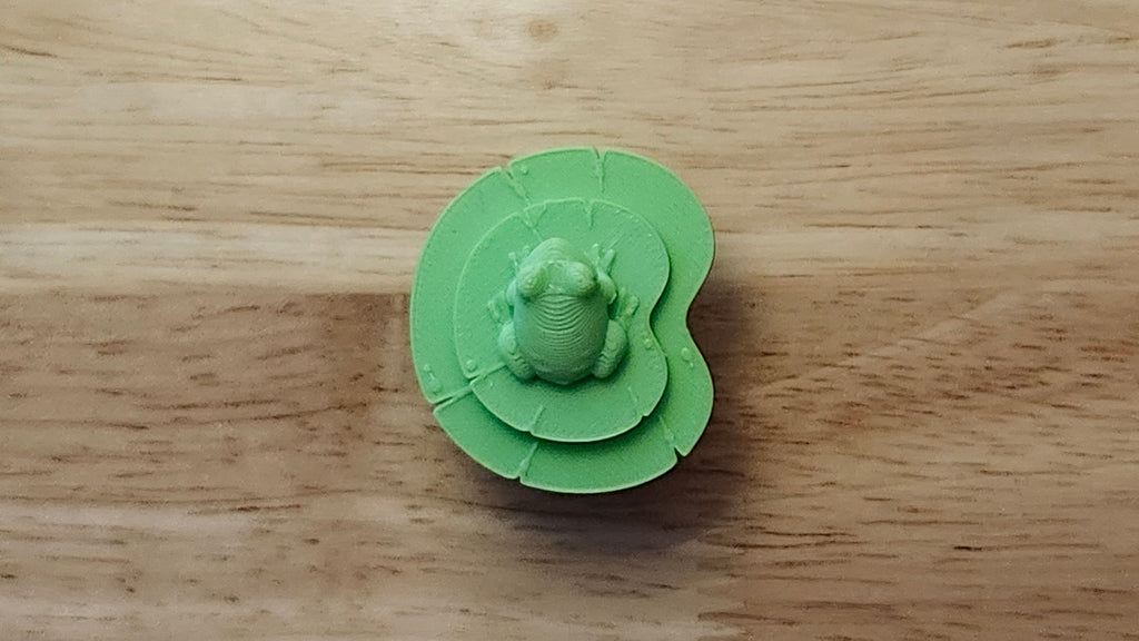 Frog Button Cover with Lily Pad Back. 3D printed for use as a bow tie, button cover, necklace, pin, hat pin, lapel pin and so much more. 