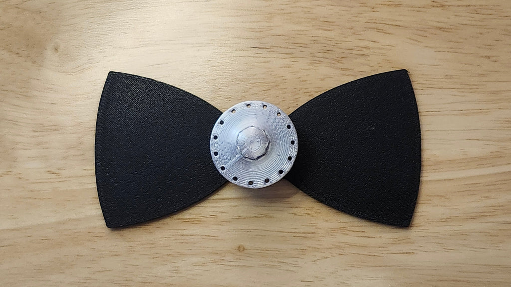 UFO Button Cover with Alien Peace Hand Bow (reverse side shown). 3D printed for use as a bow tie, button cover, necklace, pin, hat pin, lapel pin and so much more.