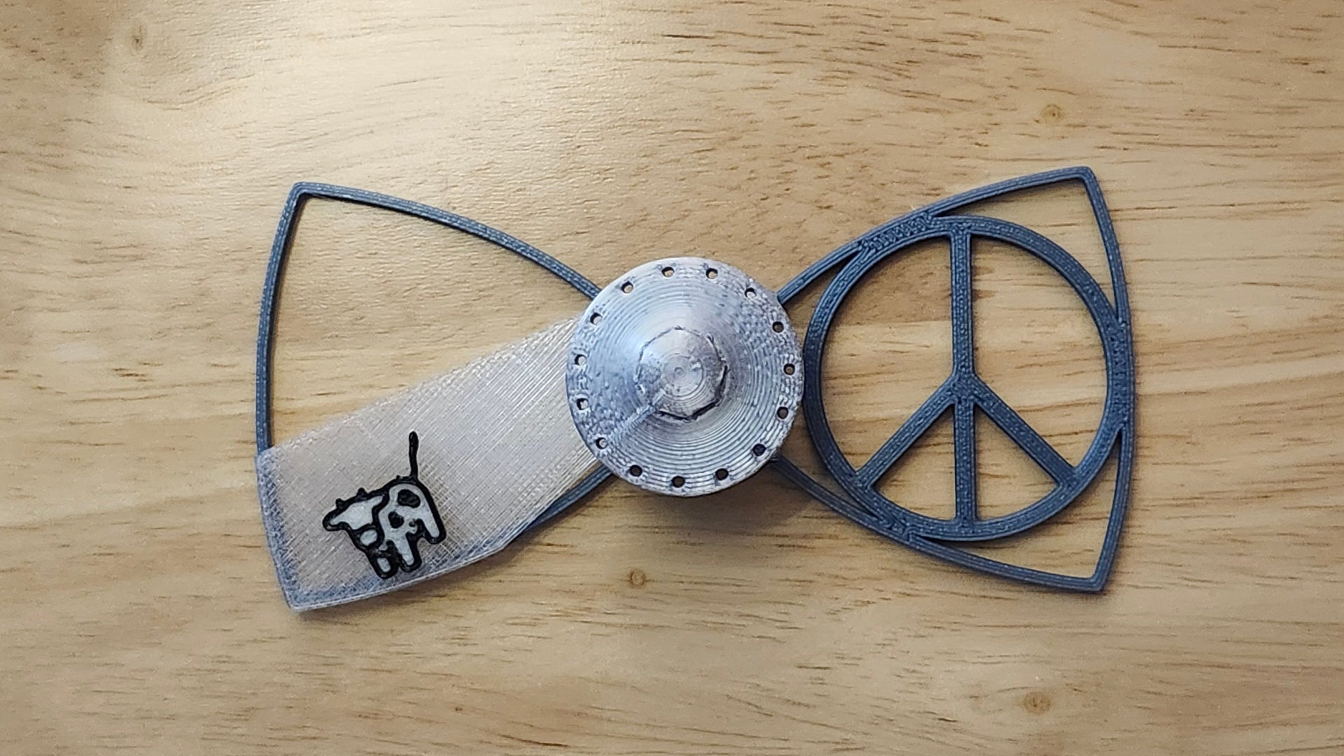 UFO Button Cover and Cow Beaming Back with Peace Sign Bow. 3D printed for use as a bow tie, button cover, necklace, pin, hat pin, lapel pin and so much more.