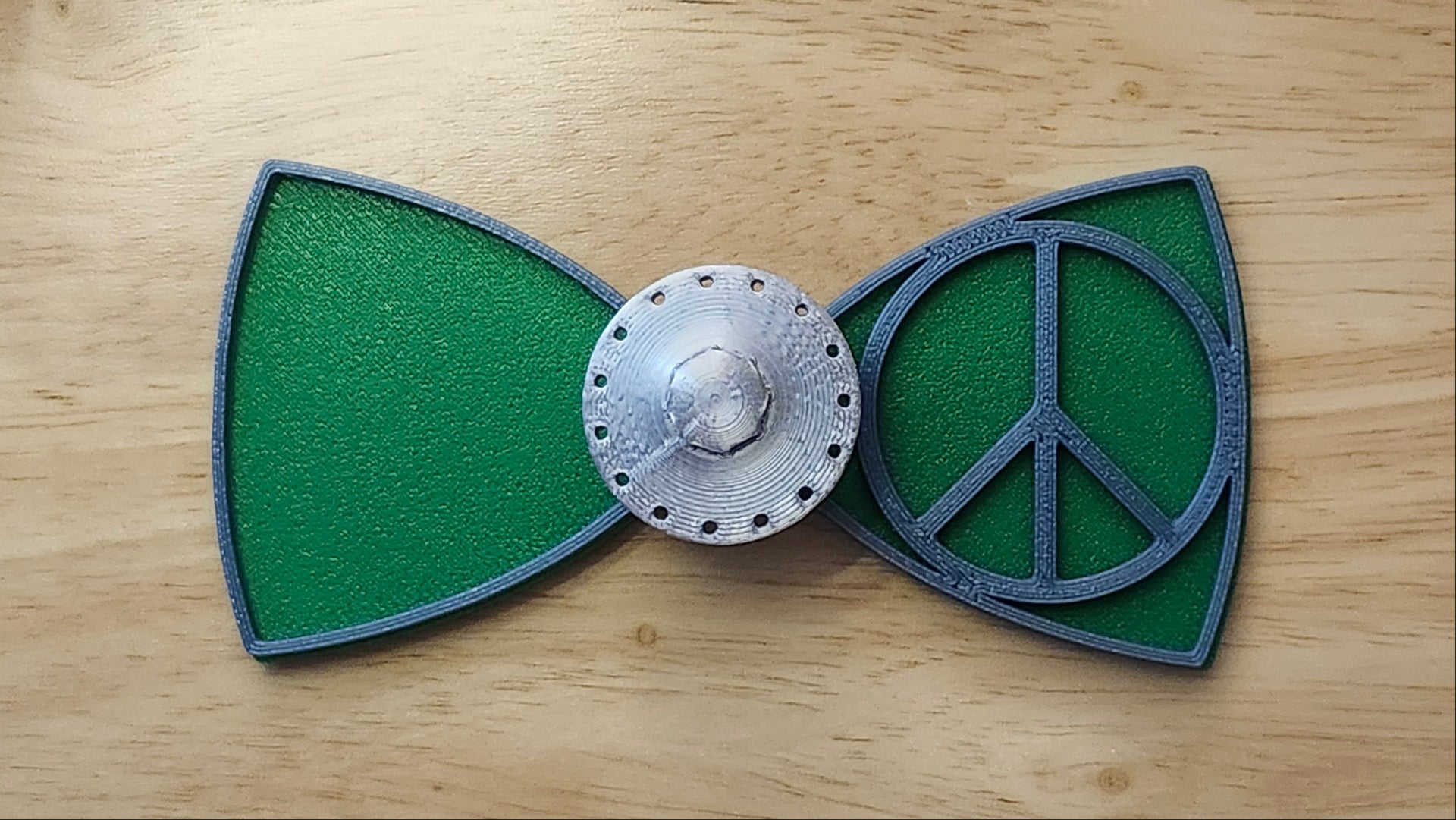 UFO Button Cover and Peace Sign Bow with Alien Head Bow (reverse side). 3D printed for use as a bow tie, button cover, necklace, pin, hat pin, lapel pin and so much more.