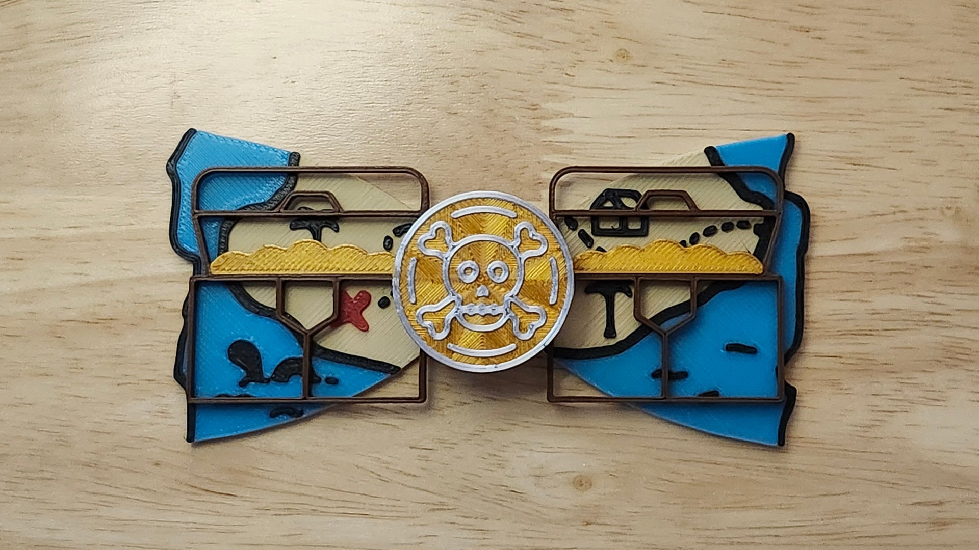 Doubloon Button Cover with Treasure Map Bow and Treasure Chest Back. 3D printed for use as a bow tie, button cover, necklace, pin, hat pin, lapel pin and so much more.