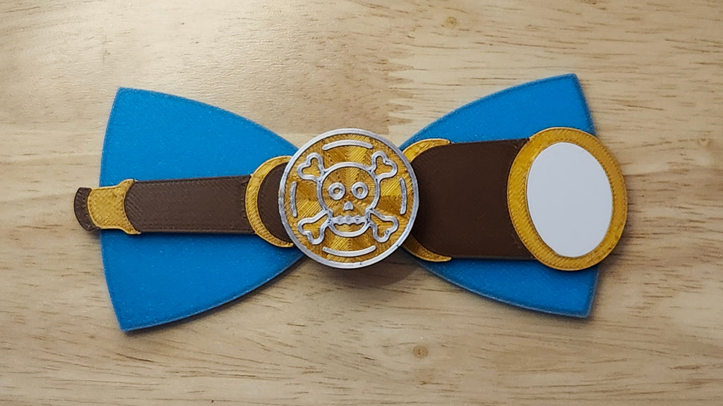 Doubloon Button Cover with Ship Bow (reverse side shown) and Spyglass Back. 3D printed for use as a bow tie, button cover, necklace, pin, hat pin, lapel pin and so much more.