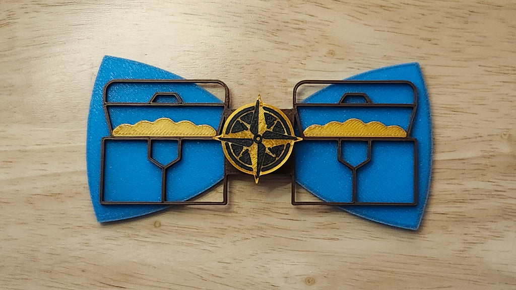 Compass Button Cover with Ship Bow (reverse side shown) and Treasure Chest Back. 3D printed for use as a bow tie, button cover, necklace, pin, hat pin, lapel pin and so much more.