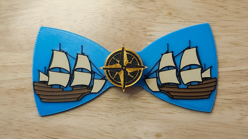 Compass Button Cover with Ship Bow. 3D printed for use as a bow tie, button cover, necklace, pin, hat pin, lapel pin and so much more.