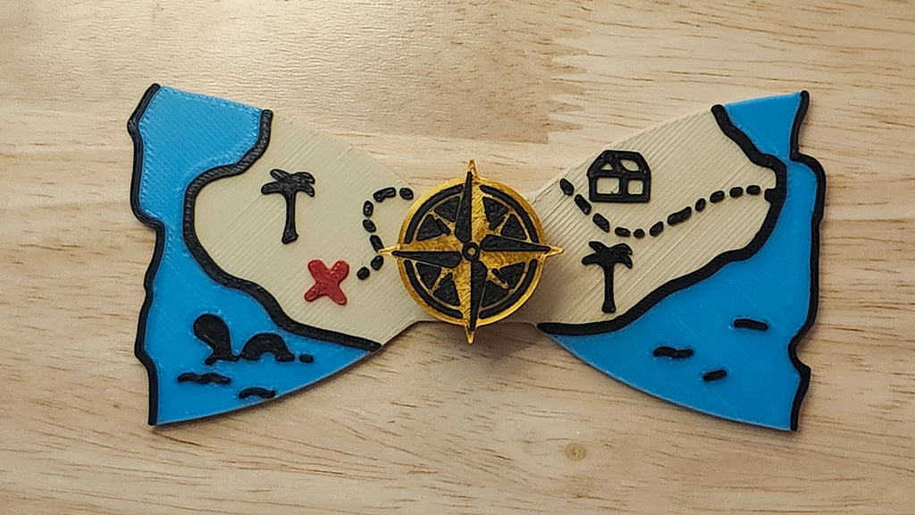 Compass Button Cover with Treasure Map Bow. 3D printed for use as a bow tie, button cover, necklace, pin, hat pin, lapel pin and so much more.