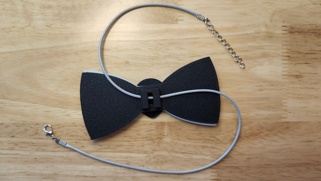 reverse side shown to demonstrate how it is worn with the included necklace. 