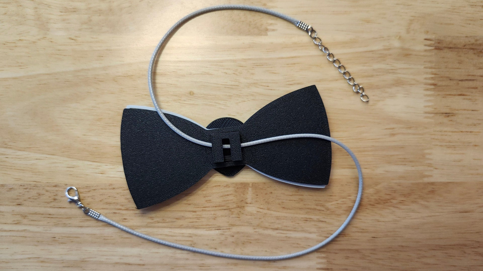 reverse side shown to demonstrate how it is worn with the included necklace. 