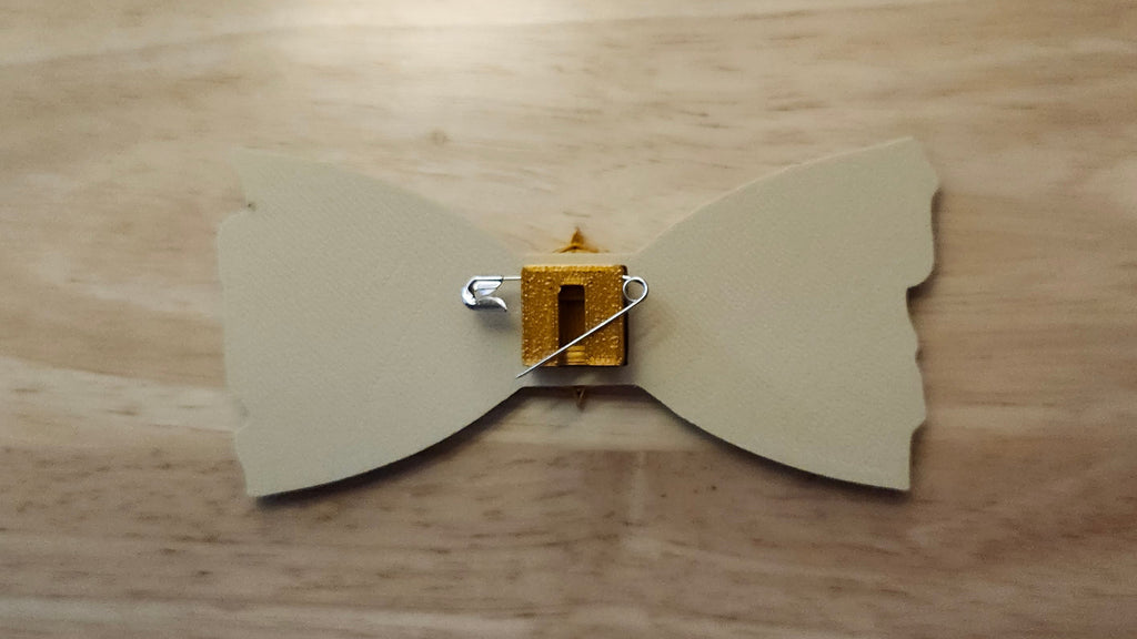 Compass Button Cover with Treasure Map Bow reverse side shown to demonstrate how to turn it in to a pin with the included safety pin.  