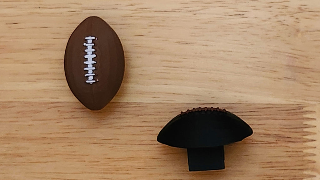 Two Football Bases: one from front, one from side